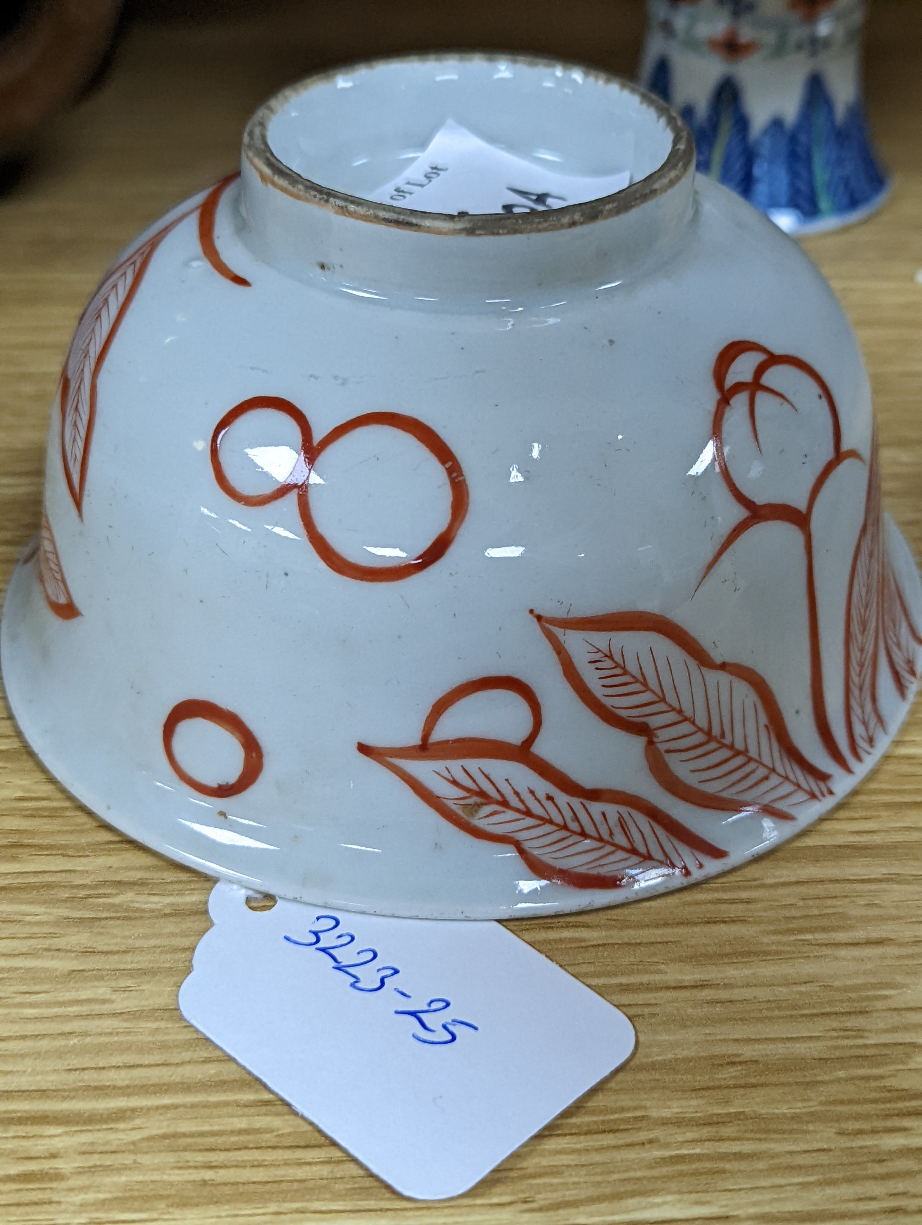 A Chinese blue and white water pipe vessel, a doucai stem dish and a Japanese Imari bowl, 19th century, (3)